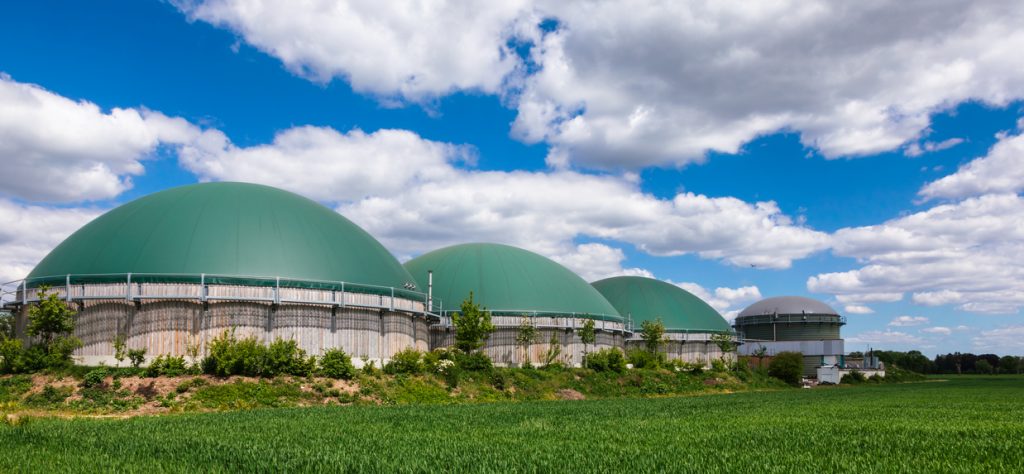 Anaerobic digesters or Biogas plant producing biogas from agricultural waste in rural Germany. Modern Biofuel Industry concept